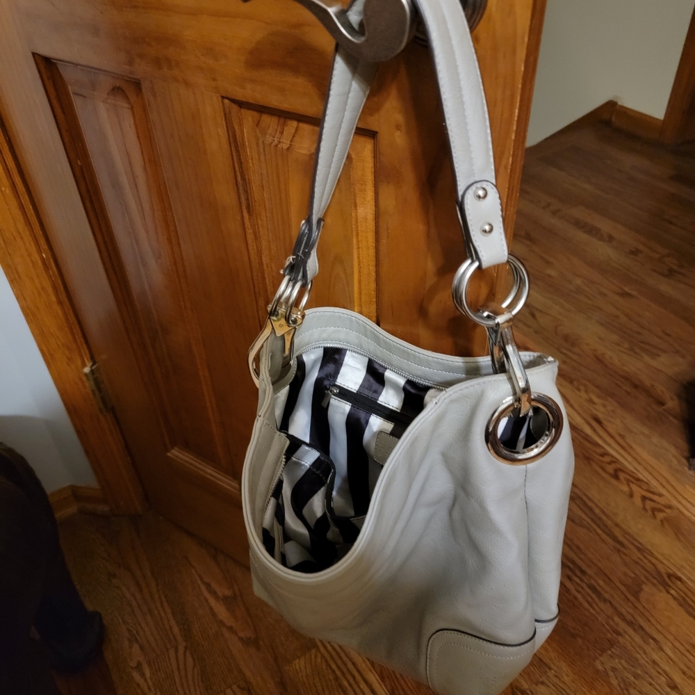 Stylish chrome hardware Charming Charlie handbag